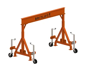 Portable orange gantry crane with adjustable height on wheels.